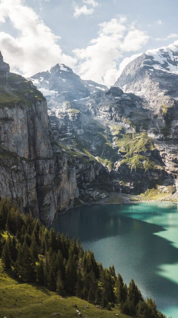 Scenic Lake Oeschinen with impressive cliffs and mountains