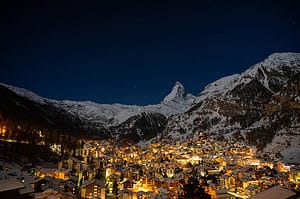 Zermatt village at night with matterhorn in the background