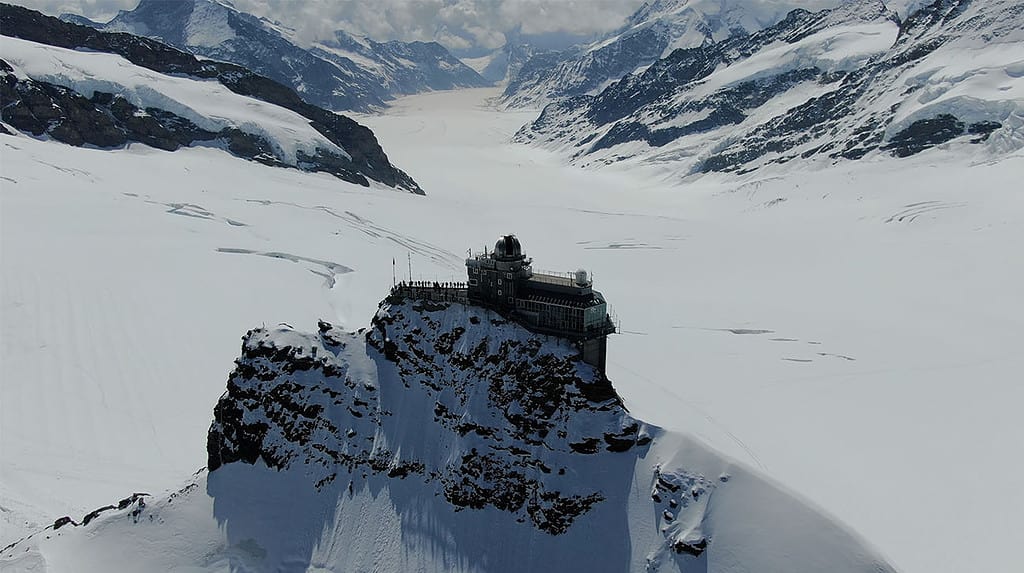 the sphynx observatory at jungfraujoch in front of the great aletsch glacier
