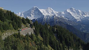 Aerial view of the schynige platte railway with eiger, mönch and jungfrau peaks in the background