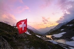 A swiss Flag in the mountains